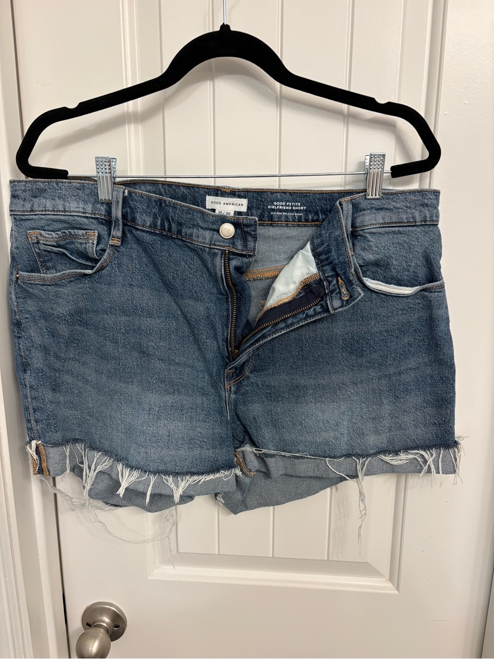 Good American Distressed Light Blue Denim Cutoff Shorts